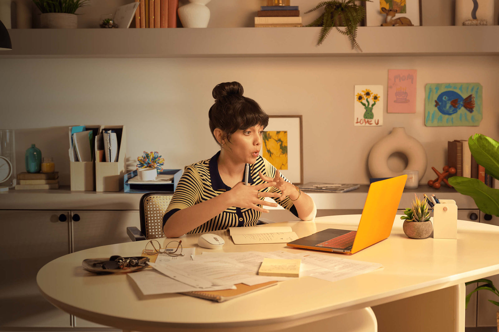 woman at her at-home desk on a conference call