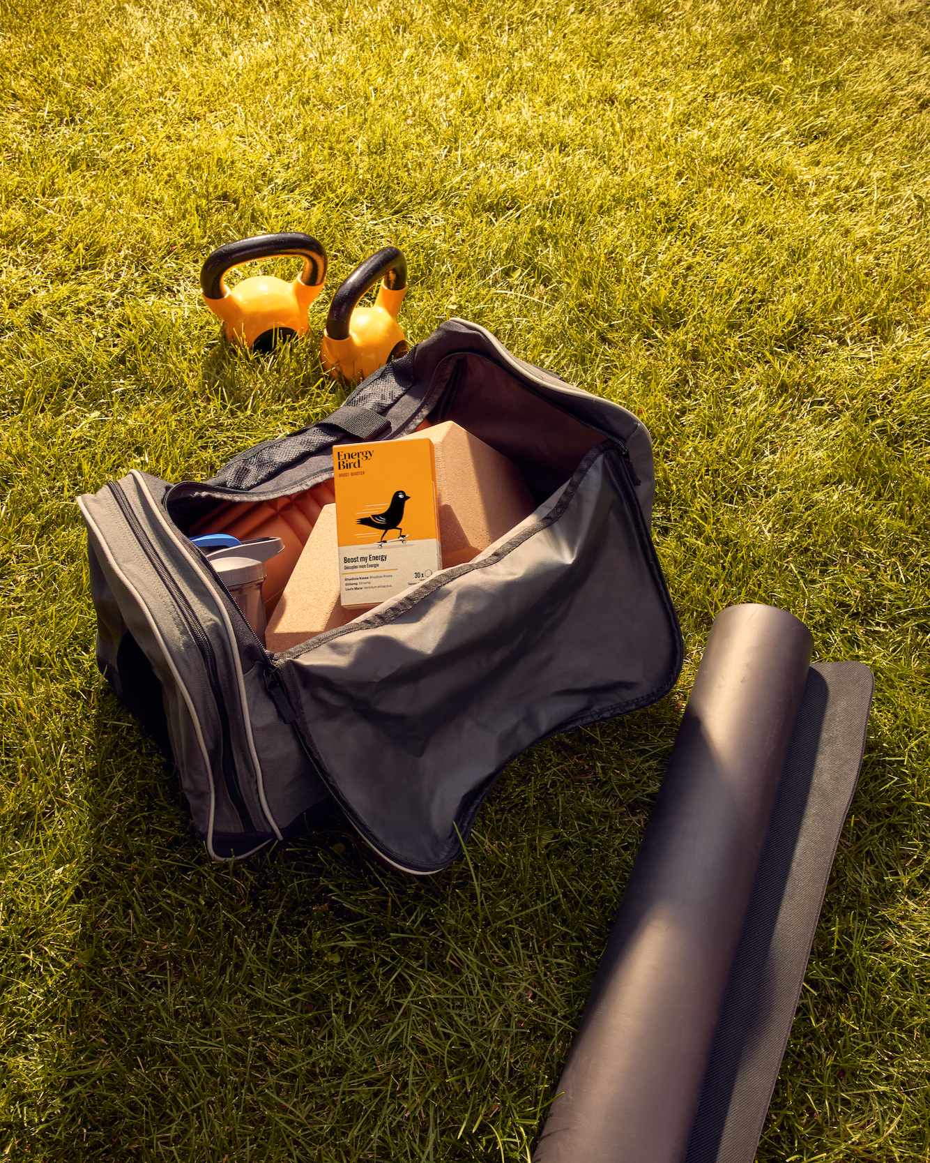 Energy Bird's Boost my Energy in a gym bag beside workout gear