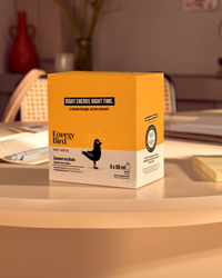 Emballage Stimuler mon cerveau par Energy Bird sur une table à côté de cahiers et d'un stylo