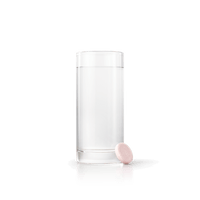 Energy Bird Build My Energy tablet beside a glass of water