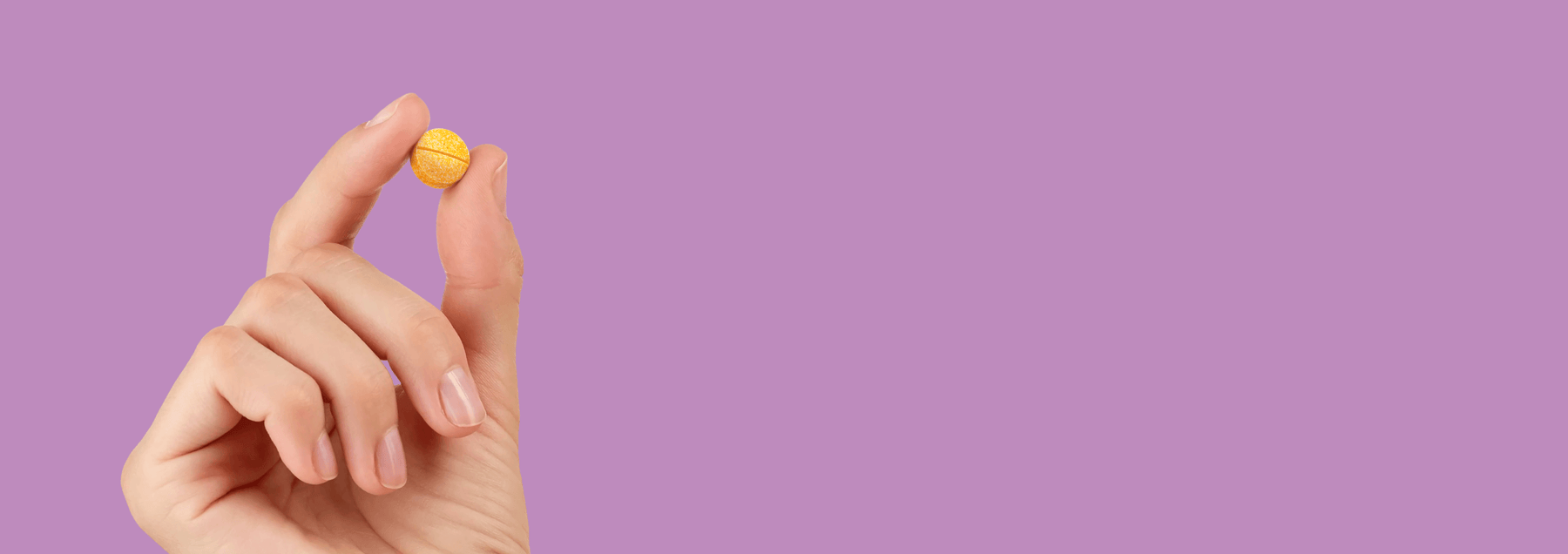 Energy Bird Calm My Mind pill being held against a purple background